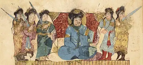 Turkic amir with guards in Maqamat al-Hariri, wearing the sharbush headgear, the three-quarters length robe, and boots, at Rayy, Iran, 1237.[138][139]