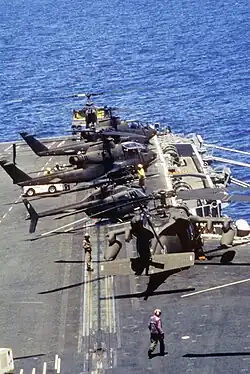 US Army Sikorsky UH-60 Black Hawk, Bell AH-1 Cobra and Bell OH-58 Kiowa helicopters on deck of the US Navy aircraft carrier USS&nbsp;Dwight D. Eisenhower off Haiti, 1994.